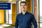 Sean Myers stands in a sunlit room with hands in his pockets