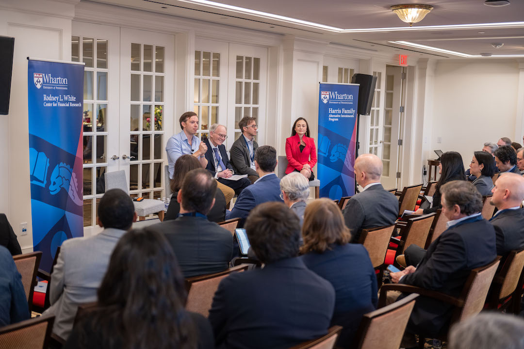 An audience watches the "Tidal Wave in Finance" panel speak at the Future of Finance Forum