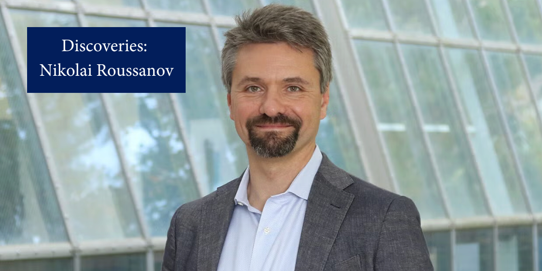 A man smiling in a sunlit room with windows in the background. Text reads, "Discoveries: Nikolai Roussanov"