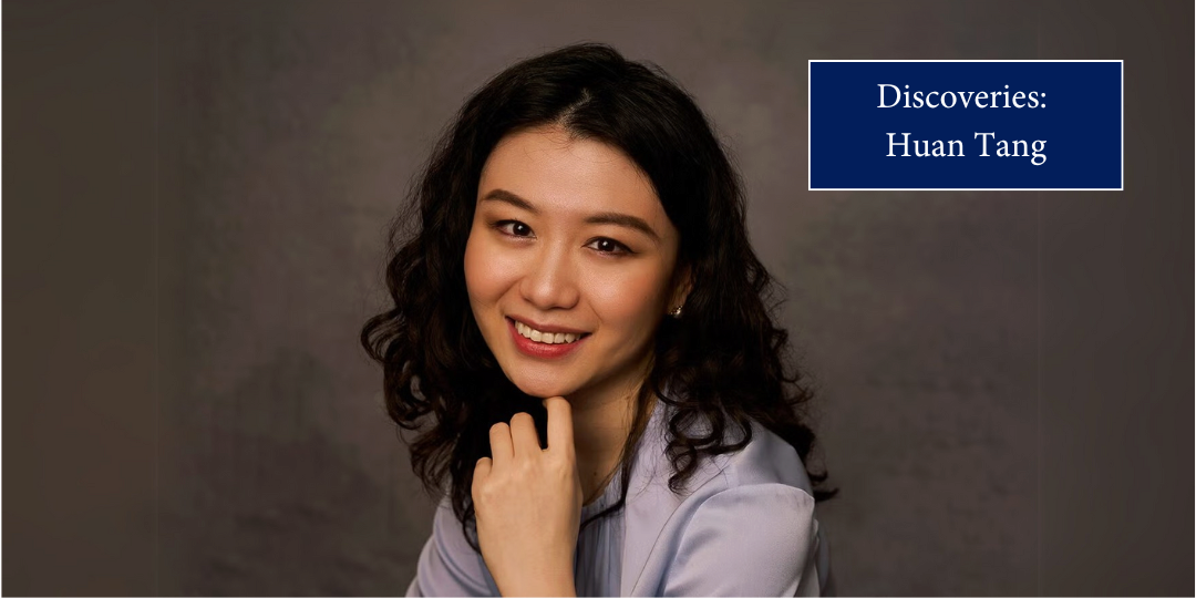 A person smiles toward the viewer. The text reads "Discoveries: Huan Tang"