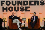 Two speakers in conversation onstage