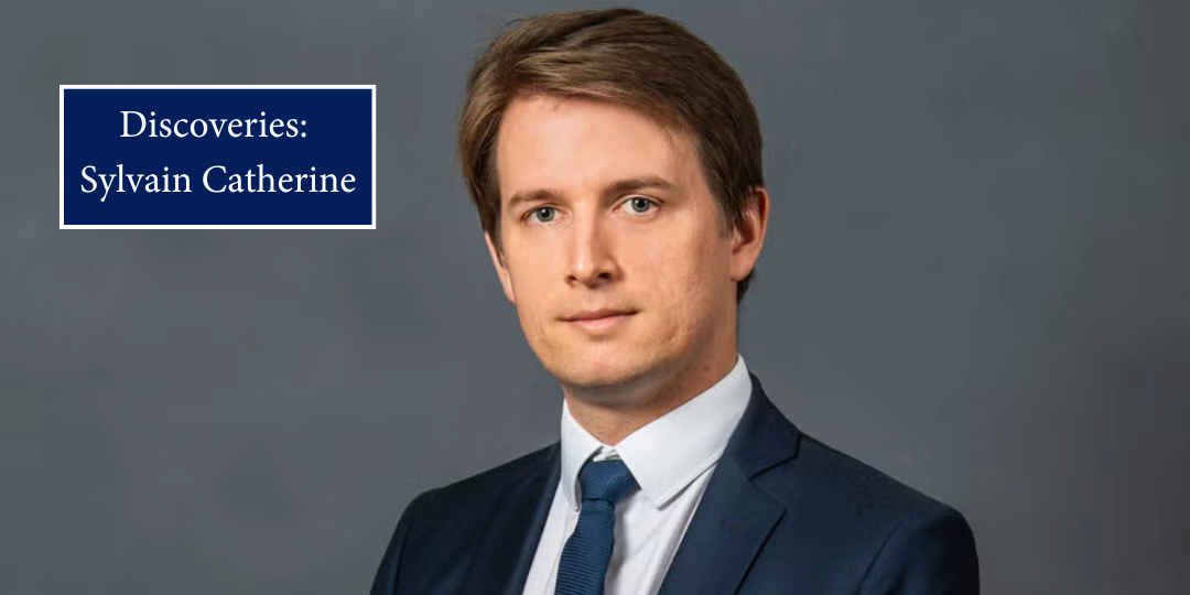 A headshot of a person smiling before a grey background. A caption reads "Discoveries: Sylvain Catherine"